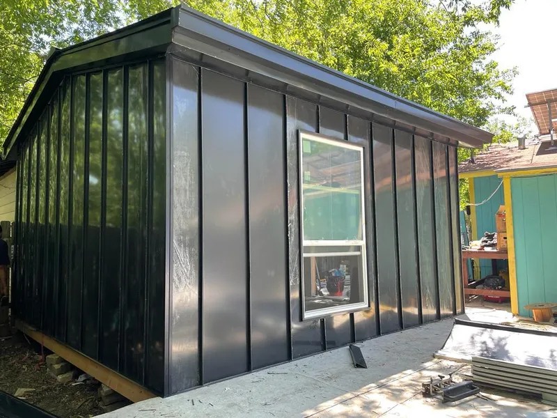 Black standing seam metal wall panels for Roof Inspection in Gulf Hills